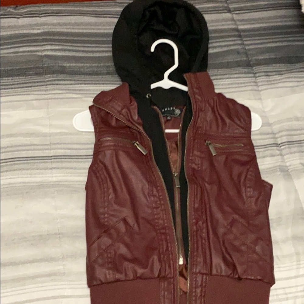 Reddish colored vest with hood
